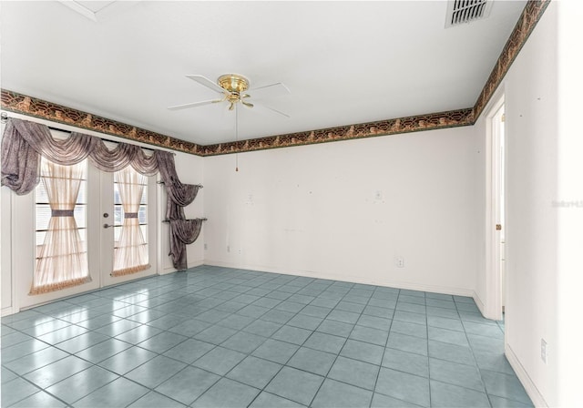 6172 SW 101st Pl, Ocala, FL 34476 - spare room with french doors, ceiling fan, and light tile patterned flooring