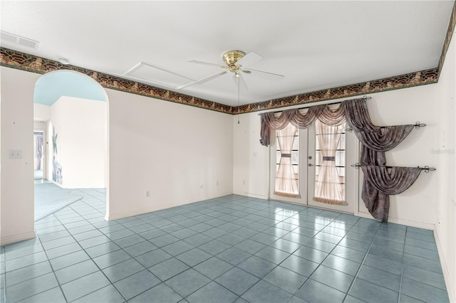 6172 SW 101st Pl, Ocala, FL 34476 - tiled spare room with arched walkways, healthy amount of natural light, ceiling fan, and french doors