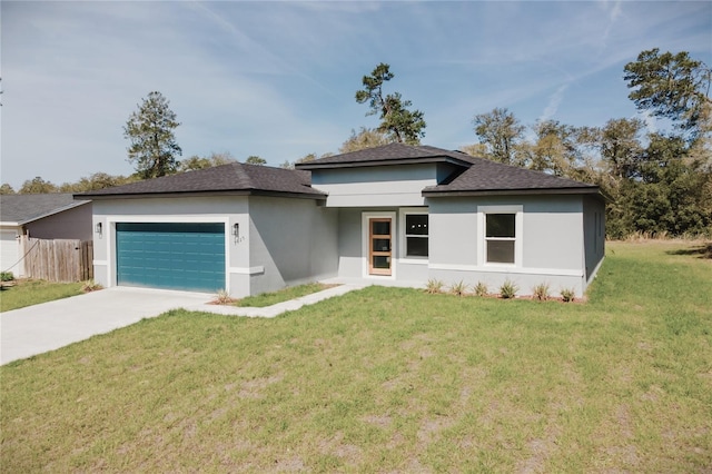 3325 SW 165th Loop, Ocala, FL 34473 - prairie-style house featuring an attached garage, stucco siding, driveway, and roof with shingles