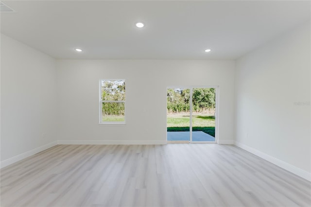 3325 SW 165th Loop, Ocala, FL 34473 - empty room with light wood-style floors and recessed lighting