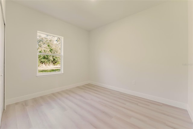 3325 SW 165th Loop, Ocala, FL 34473 - empty room featuring light wood-style floors and baseboards