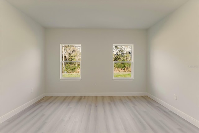 3325 SW 165th Loop, Ocala, FL 34473 - unfurnished room featuring light wood-type flooring and baseboards