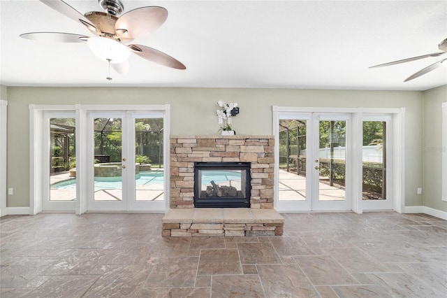 2908 SE 22nd Ave, Ocala, FL 34471 - unfurnished living room featuring ceiling fan, plenty of natural light, and stone finish flooring