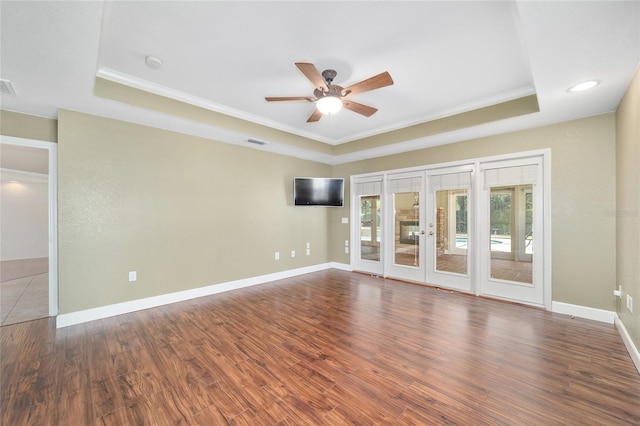 2908 SE 22nd Ave, Ocala, FL 34471 - unfurnished room featuring a tray ceiling, crown molding, ceiling fan, french doors, and wood finished floors