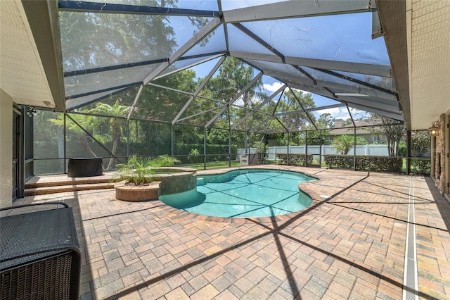 2908 SE 22nd Ave, Ocala, FL 34471 - view of pool with a patio, a pool with connected hot tub, a lanai, and a fenced backyard