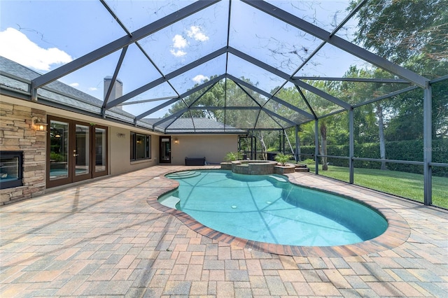 2908 SE 22nd Ave, Ocala, FL 34471 - view of pool featuring a patio, a pool with connected hot tub, a lanai, and french doors