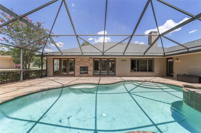 2908 SE 22nd Ave, Ocala, FL 34471 - swimming pool with french doors, a patio area, a lanai, and a hot tub