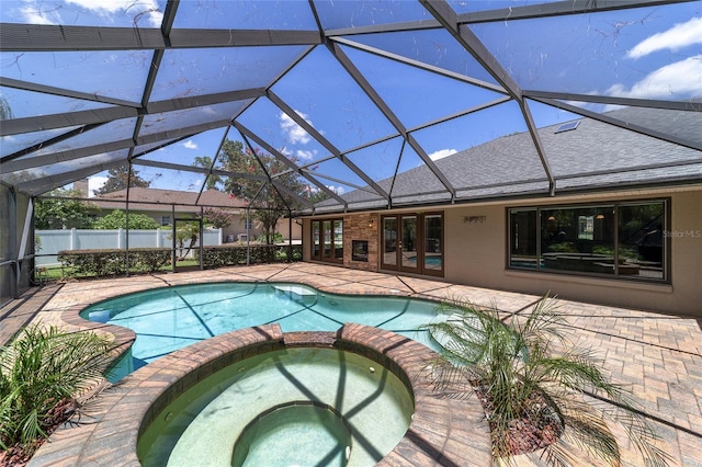 2908 SE 22nd Ave, Ocala, FL 34471 - view of pool with french doors, a pool with connected hot tub, a patio area, and glass enclosure