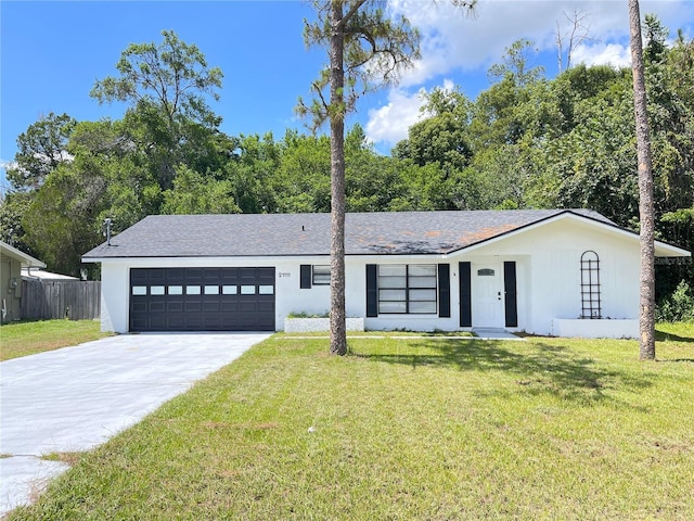 21111 SW Honeysuckle St, Dunnellon, FL 34431 - view of front of house with concrete driveway and an attached garage