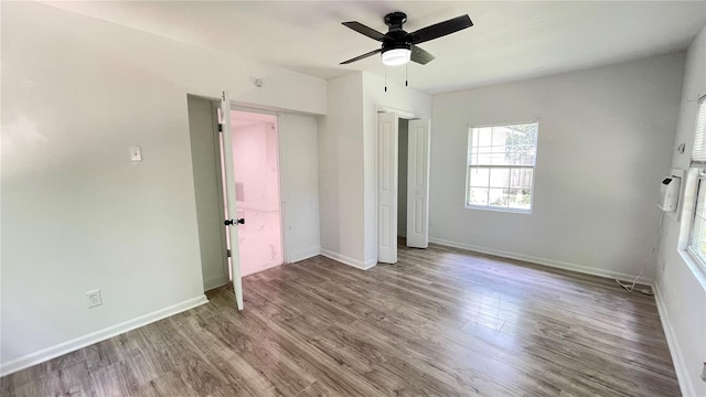 21111 SW Honeysuckle St, Dunnellon, FL 34431 - unfurnished bedroom with wood finished floors, a closet, and ceiling fan