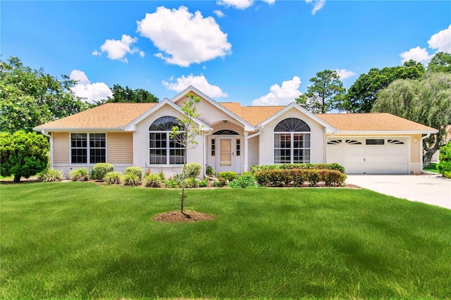 10819 SW 84th Ter, Ocala, FL 34481 - ranch-style home with a front lawn, an attached garage, driveway, brick siding, and a shingled roof
