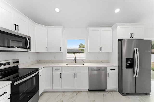 36 Pine Radl, Ocala, FL 34472 - kitchen with appliances with stainless steel finishes, light marble finish flooring, recessed lighting, and white cabinets