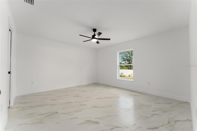 36 Pine Radl, Ocala, FL 34472 - unfurnished room with a ceiling fan and light marble finish flooring