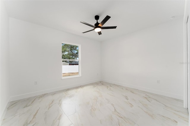36 Pine Radl, Ocala, FL 34472 - empty room featuring marble look tiles and a ceiling fan