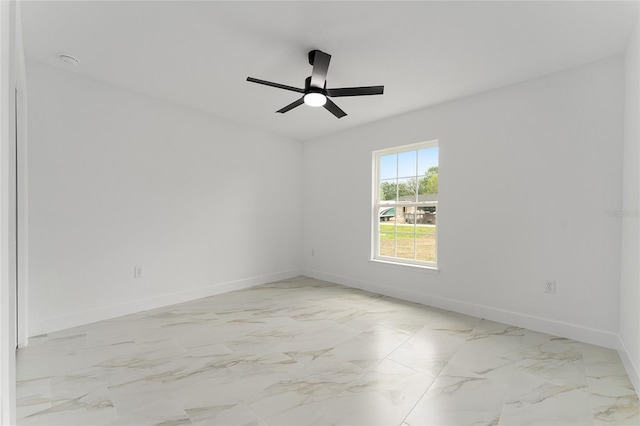 36 Pine Radl, Ocala, FL 34472 - spare room with light marble finish floors and ceiling fan
