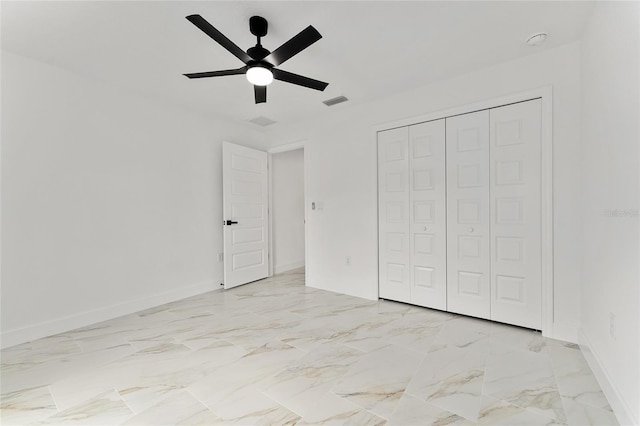 36 Pine Radl, Ocala, FL 34472 - unfurnished bedroom featuring ceiling fan, a closet, and light marble finish floors