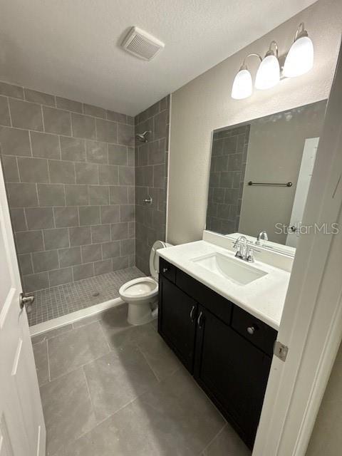 2350 SW 150th Ct, Ocala, FL 34481 - bathroom with vanity, a shower stall, and tile patterned floors