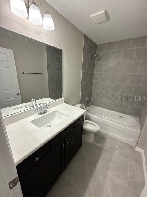 2350 SW 150th Ct, Ocala, FL 34481 - bathroom with vanity, bathing tub / shower combination, tile patterned floors, a textured ceiling, and a textured wall