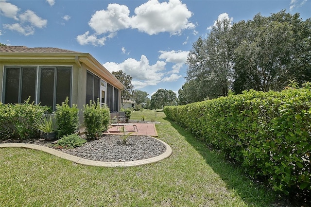 13170 SE 92nd Court Rd, Summerfield, FL 34491 - view of green lawn with a patio area