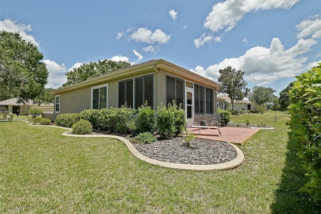 13170 SE 92nd Court Rd, Summerfield, FL 34491 - back of property with a patio area, a yard, and stucco siding