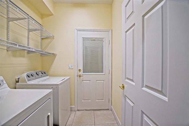 13170 SE 92nd Court Rd, Summerfield, FL 34491 - laundry area featuring separate washer and dryer and light tile patterned floors