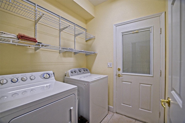 13170 SE 92nd Court Rd, Summerfield, FL 34491 - washroom featuring washer and dryer and light tile patterned floors
