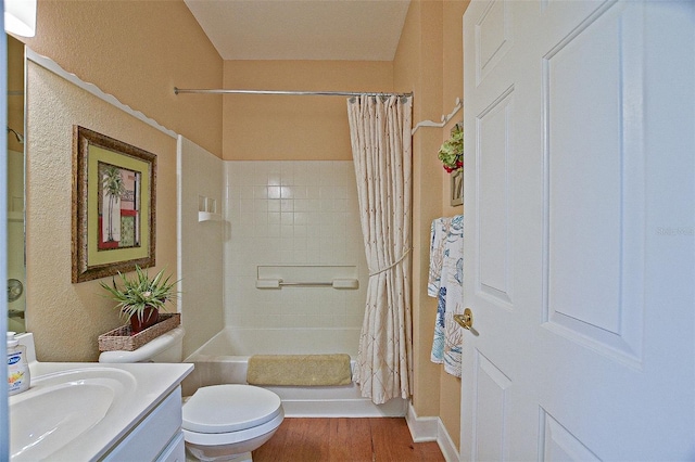 13170 SE 92nd Court Rd, Summerfield, FL 34491 - bathroom featuring vanity, wood finished floors, and shower / bathtub combination with curtain