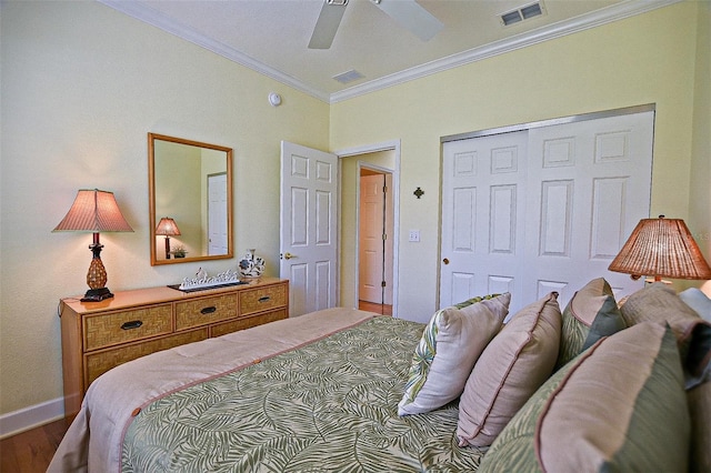 13170 SE 92nd Court Rd, Summerfield, FL 34491 - bedroom with crown molding, wood finished floors, a closet, and a ceiling fan