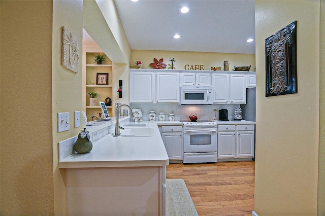 13170 SE 92nd Court Rd, Summerfield, FL 34491 - kitchen featuring white appliances, light countertops, light wood finished floors, white cabinetry, and recessed lighting