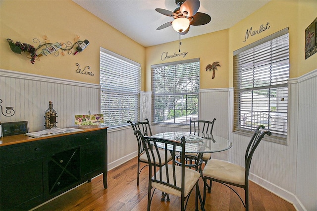 13170 SE 92nd Court Rd, Summerfield, FL 34491 - dining room featuring wainscoting, wood finished floors, and ceiling fan
