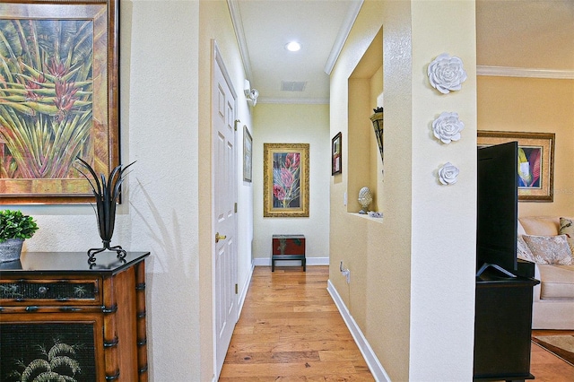 13170 SE 92nd Court Rd, Summerfield, FL 34491 - hallway with ornamental molding, light wood finished floors, recessed lighting, and a textured wall