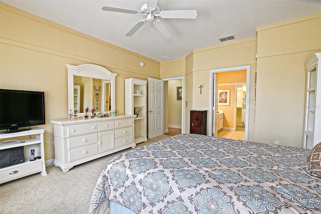 13170 SE 92nd Court Rd, Summerfield, FL 34491 - bedroom featuring light colored carpet, connected bathroom, and ceiling fan