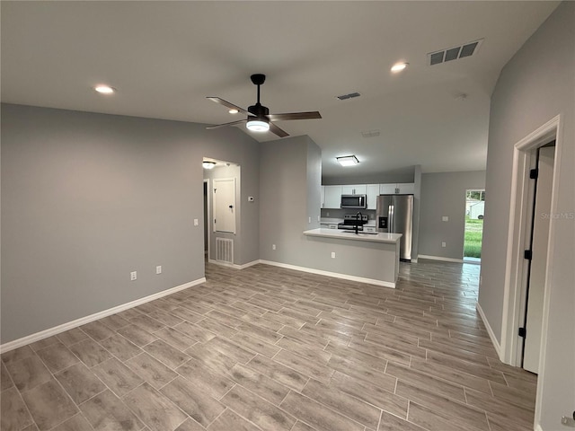 5 Laurel Pass Ln, Ocala, FL 34472 - unfurnished living room with vaulted ceiling, ceiling fan, recessed lighting, and light wood-style floors