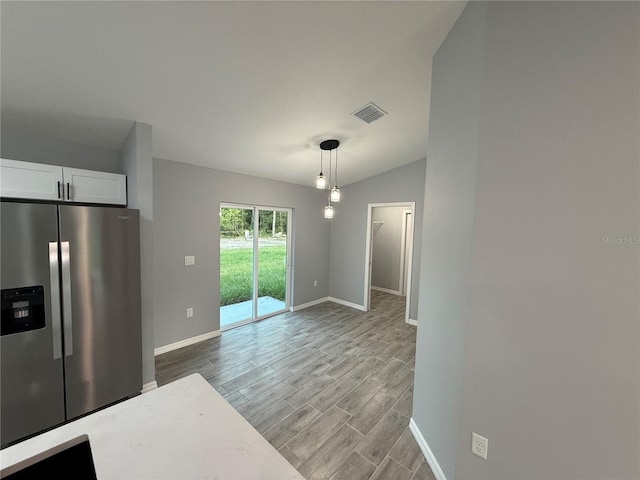5 Laurel Pass Ln, Ocala, FL 34472 - unfurnished dining area featuring wood finished floors and vaulted ceiling