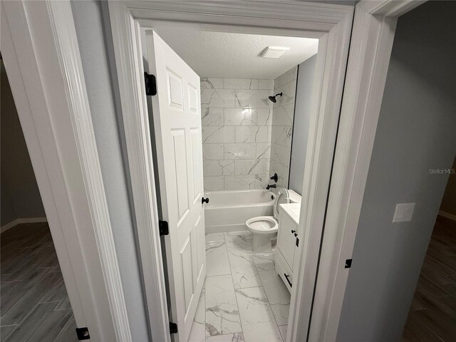 5 Laurel Pass Ln, Ocala, FL 34472 - bathroom featuring vanity, marble finish floors, a textured ceiling, and  shower combination