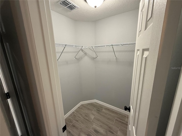 5 Laurel Pass Ln, Ocala, FL 34472 - walk in closet with wood tiled floors