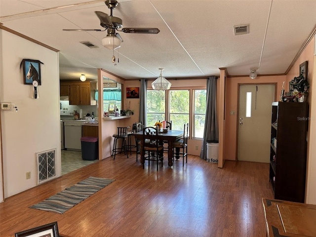 5862 SW 160th Ct, Ocala, FL 34481 - dining space featuring ceiling fan, wood finished floors, and ornamental molding