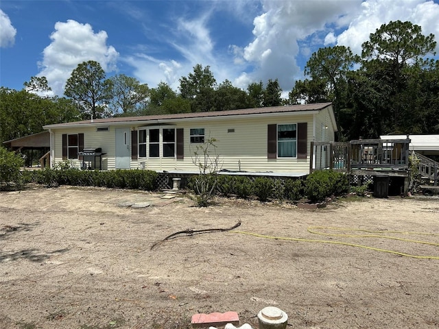 5862 SW 160th Ct, Ocala, FL 34481 - manufactured / mobile home featuring a deck and a metal roof