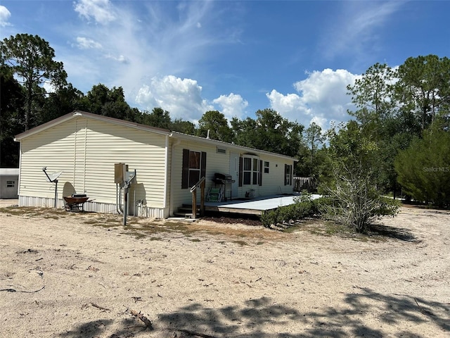 5862 SW 160th Ct, Ocala, FL 34481 - back of property with a deck