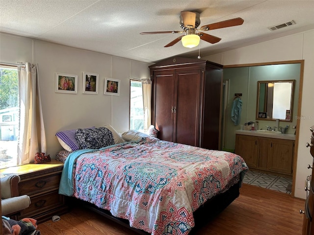 5862 SW 160th Ct, Ocala, FL 34481 - bedroom with multiple windows, light wood finished floors, ensuite bathroom, lofted ceiling, and a ceiling fan