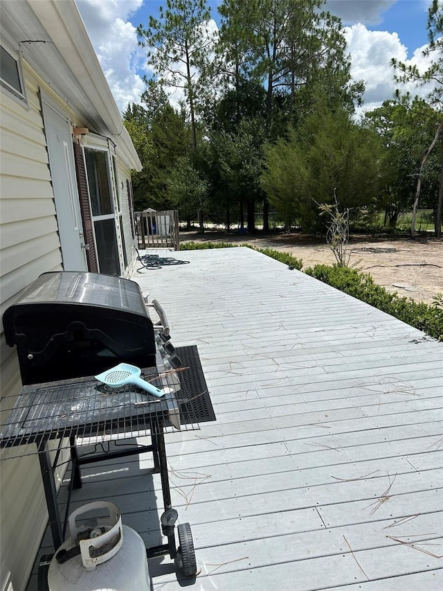 5862 SW 160th Ct, Ocala, FL 34481 - wooden terrace featuring view of scattered trees