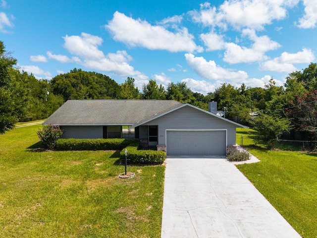 205 NE 53rd St, Ocala, FL 34479 - ranch-style house with an attached garage, concrete driveway, and a chimney