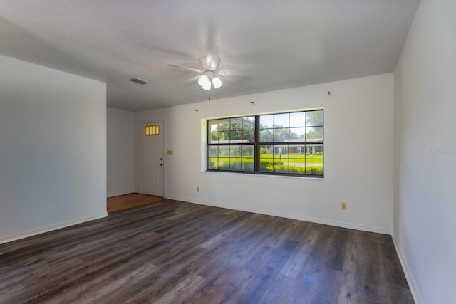 205 NE 53rd St, Ocala, FL 34479 - spare room featuring dark wood-style floors and a ceiling fan