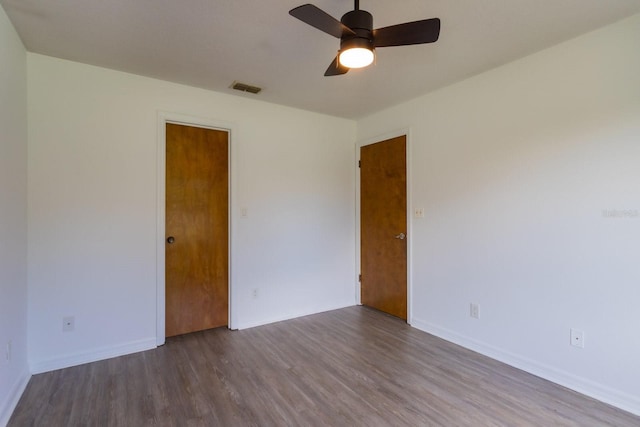 205 NE 53rd St, Ocala, FL 34479 - unfurnished room with wood finished floors and ceiling fan