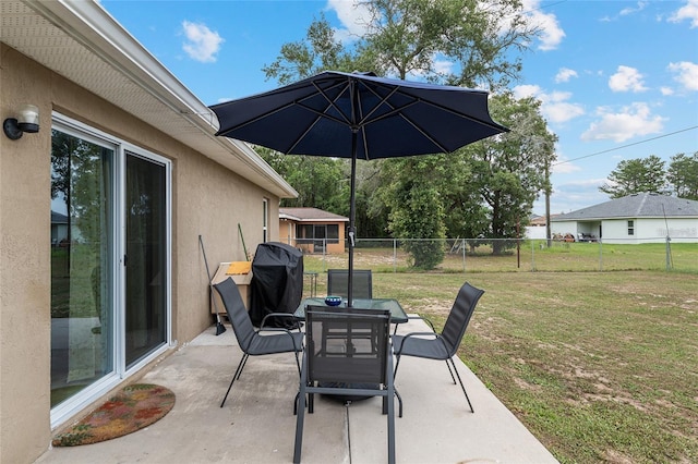 2690 SW 154th Ln, Ocala, FL 34473 - view of patio with outdoor dining area and a grill