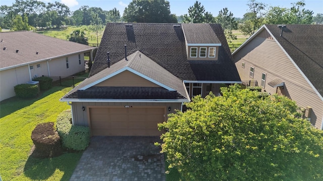 4970 NW 35th Lane Rd, Ocala, FL 34482 - view of front of house with roof with shingles, board and batten siding, driveway, an attached garage, and a front lawn
