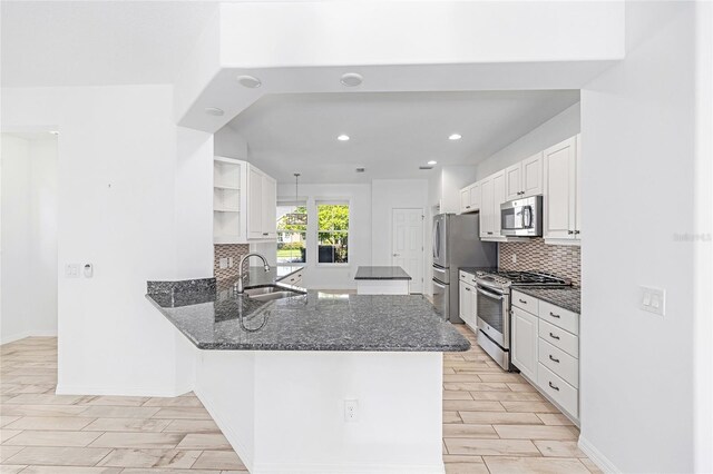 4970 NW 35th Lane Rd, Ocala, FL 34482 - kitchen featuring stainless steel appliances, open shelves, tasteful backsplash, white cabinets, and recessed lighting