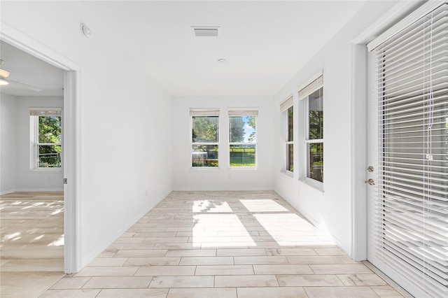 4970 NW 35th Lane Rd, Ocala, FL 34482 - unfurnished sunroom with plenty of natural light and wood finished floors