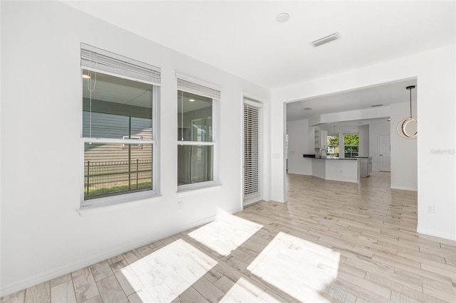 4970 NW 35th Lane Rd, Ocala, FL 34482 - empty room with light wood-style floors and baseboards