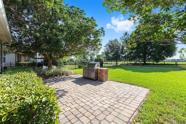 4970 NW 35th Lane Rd, Ocala, FL 34482 - fenced backyard with a patio and area for grilling